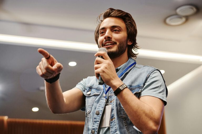 a young man talking with a microphone